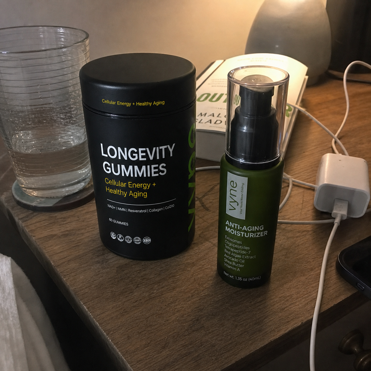Customer photo of VYNE gummies and moisturizer on a bedside table