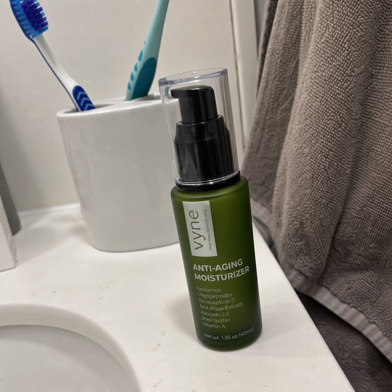 Customer photo of VYNE moisturizer on a bathroom sink