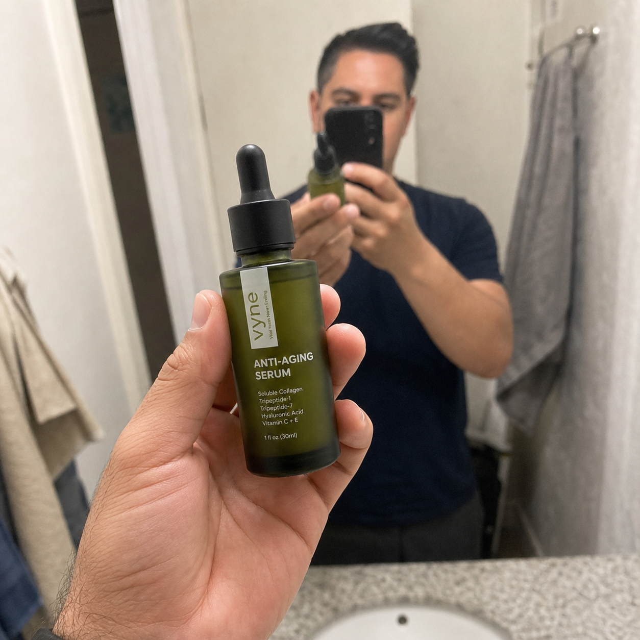 Customer holding VYNE anti-aging serum