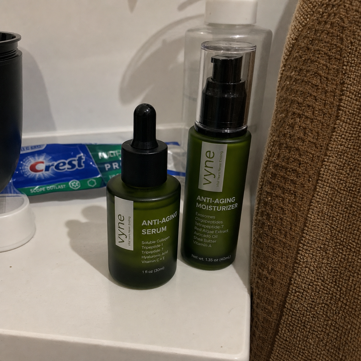 Customer photo of VYNE serum and moisturizer on a bathroom shelf